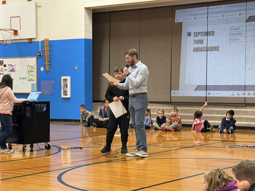 Student receiving an award from the principal.