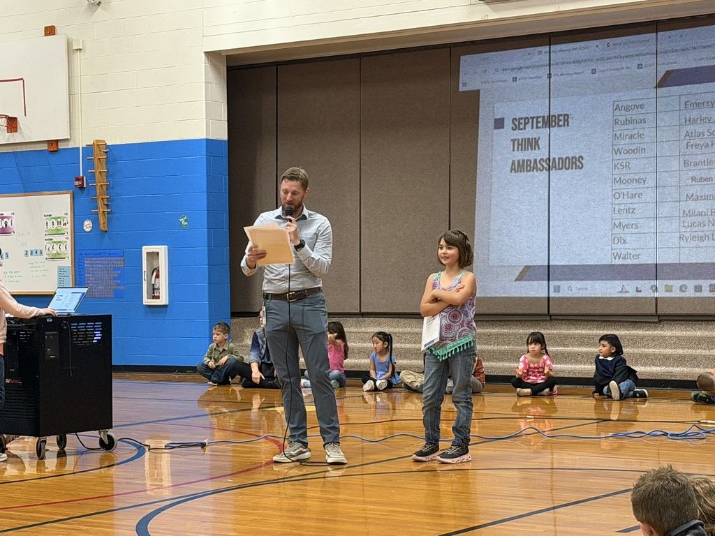 Student receiving an award from the principal.