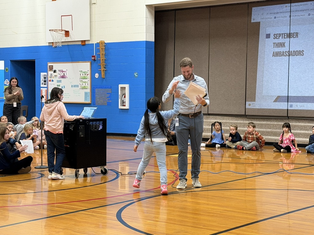 Student receiving an award from the principal.