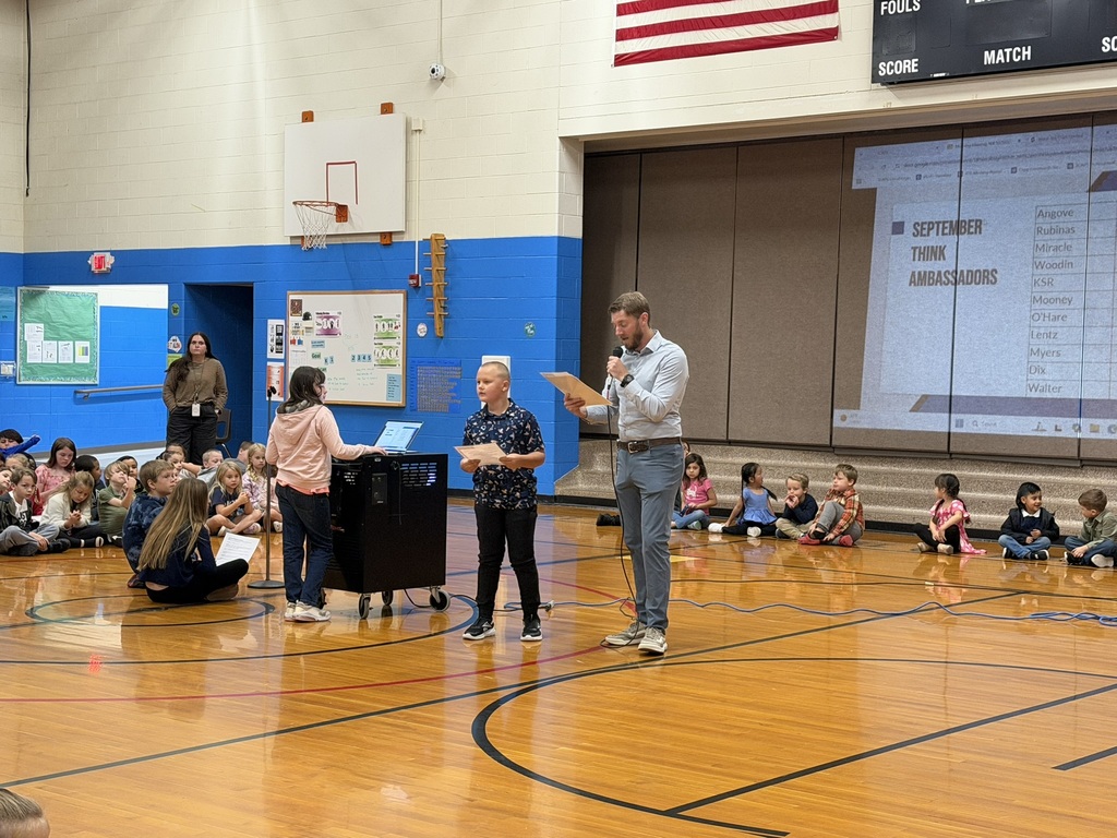 Student receiving an award from the principal.