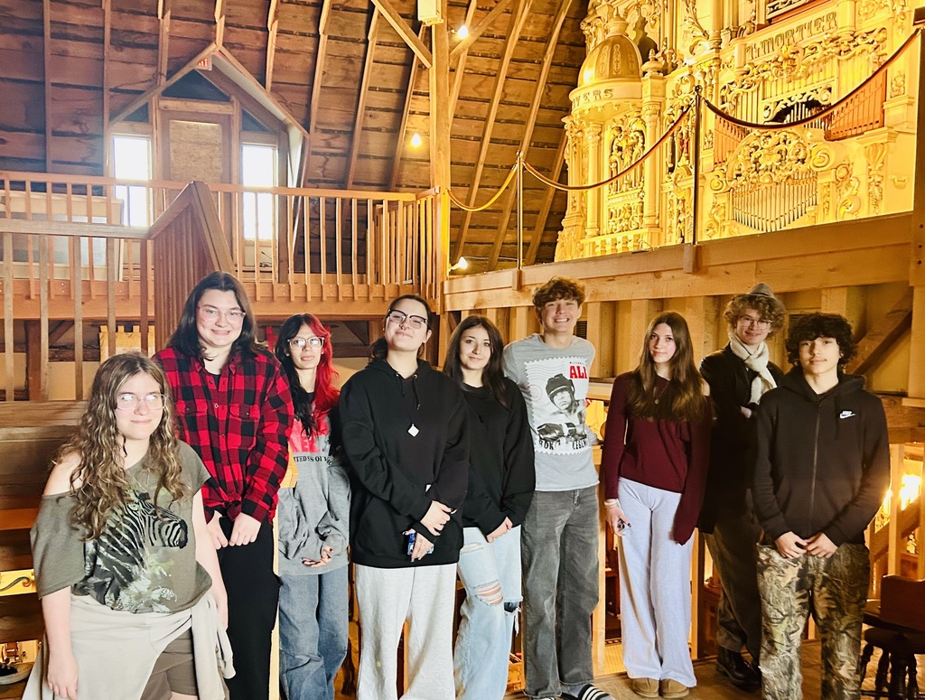 A group of TCHS students pose for a group photo on the balcony at the Music House Museum.