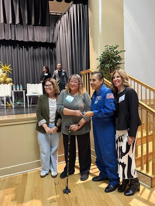 Ms. Fanning getting an award