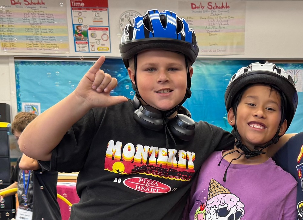 happy students with bike helmet