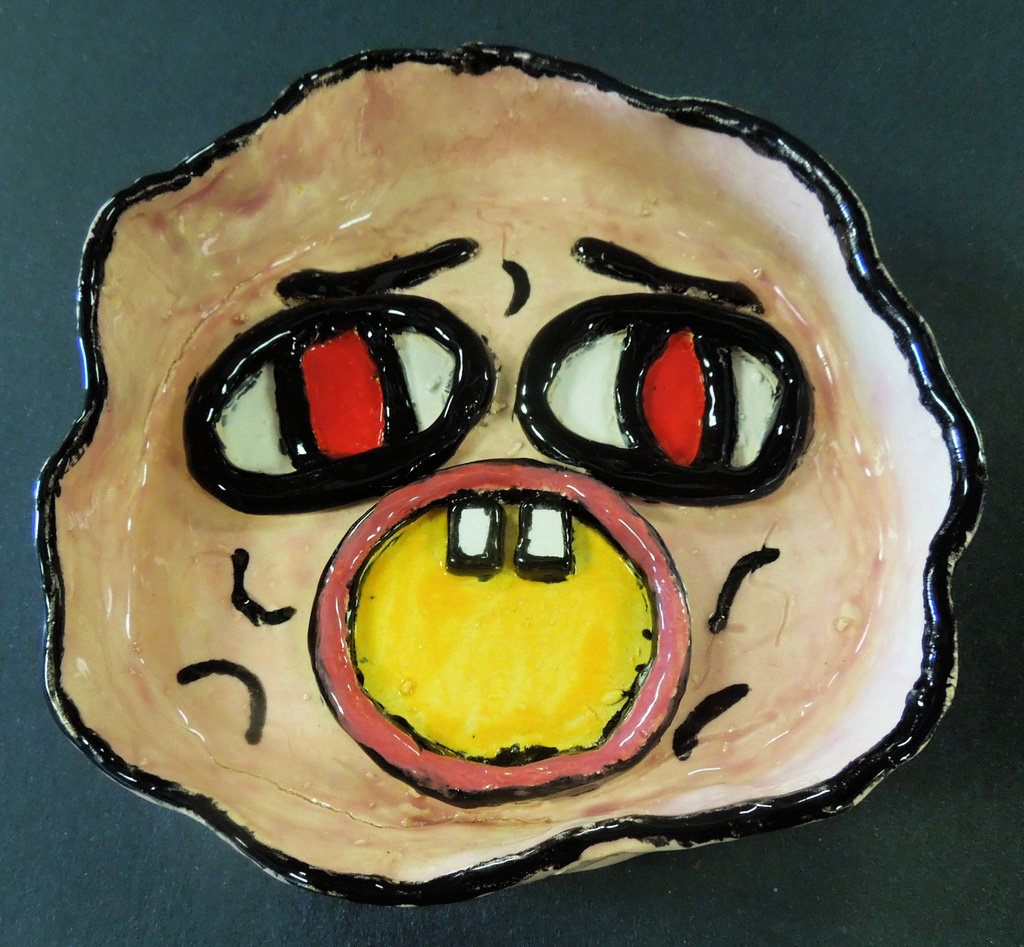 Clay vessel with face