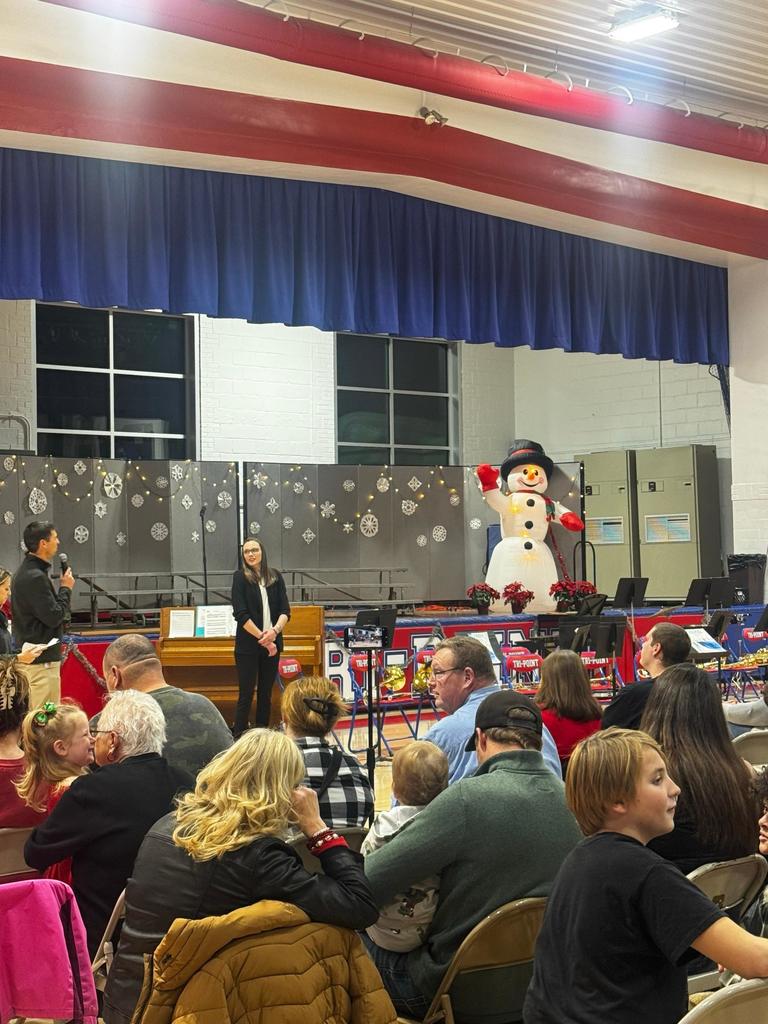 people in gym watching concert