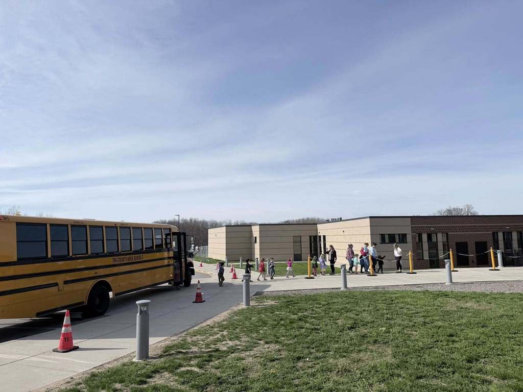 Preschool students leaving the buses to enter the elementary school.