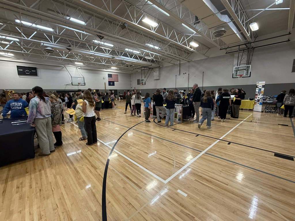 Tri County Middle School gymnasium with students and vendors for the career fair.