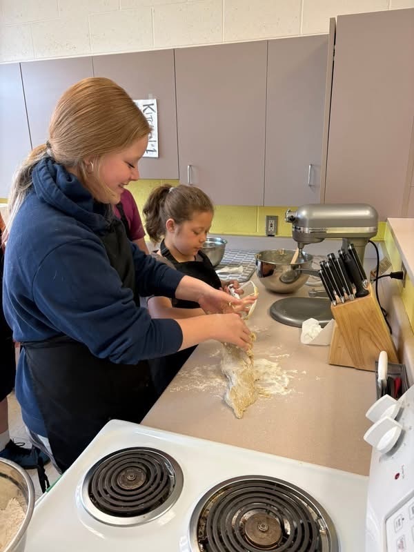 Students working with dough in culinary class