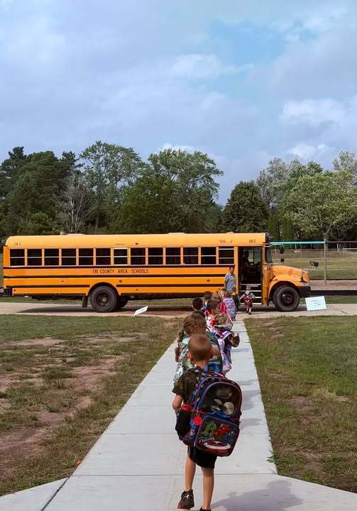 Preschool students walking to the buses.