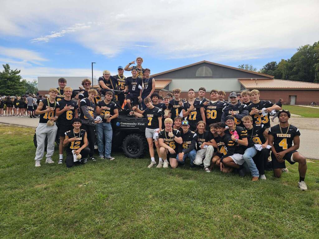 TC Football team with a donated Can-AM