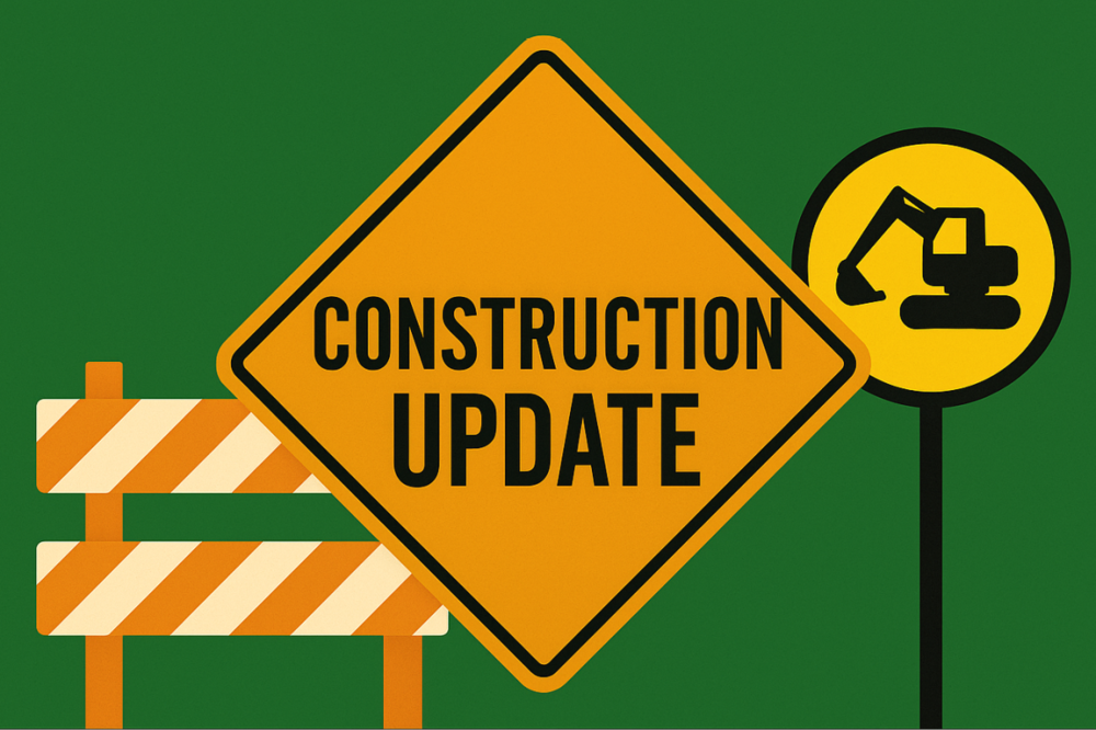 Construction Sign stating "Construction Updated" with image of a barricade and backhoe