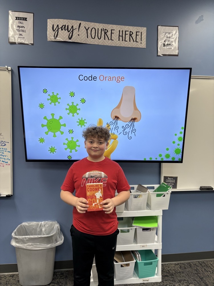 A 5th grader with his presentation on Code Orange