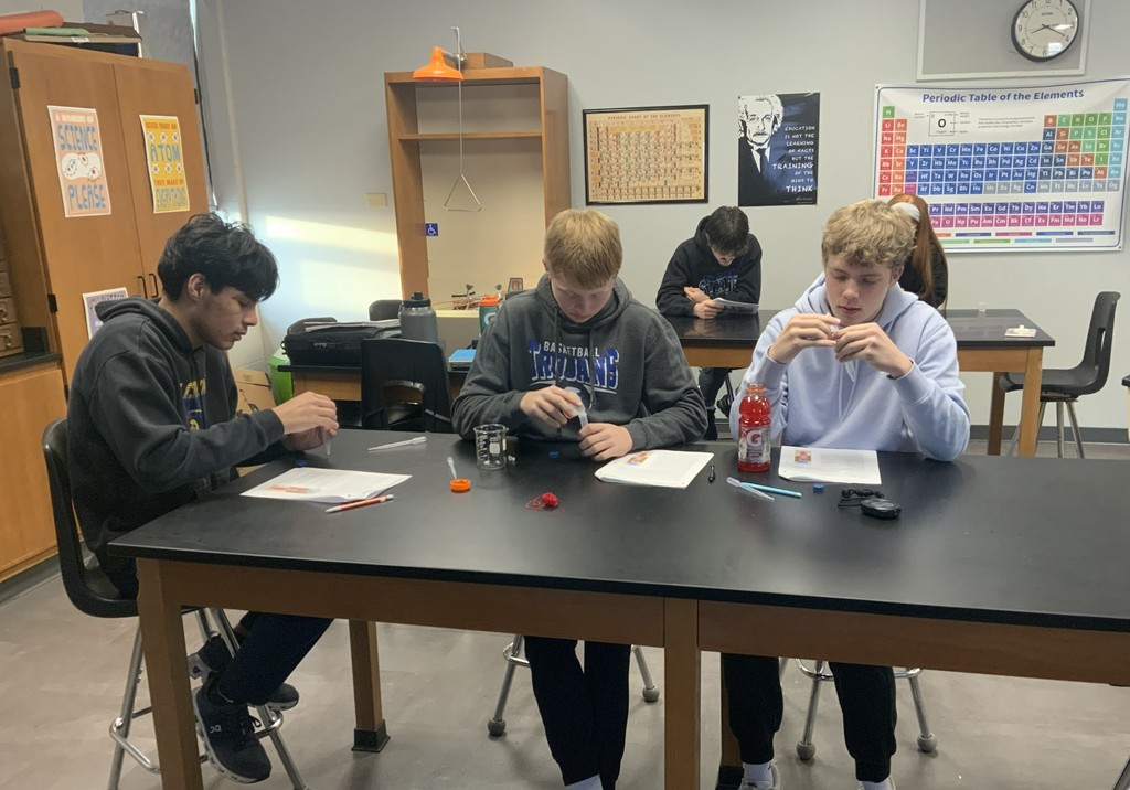 Students working through initial steps of lab set up