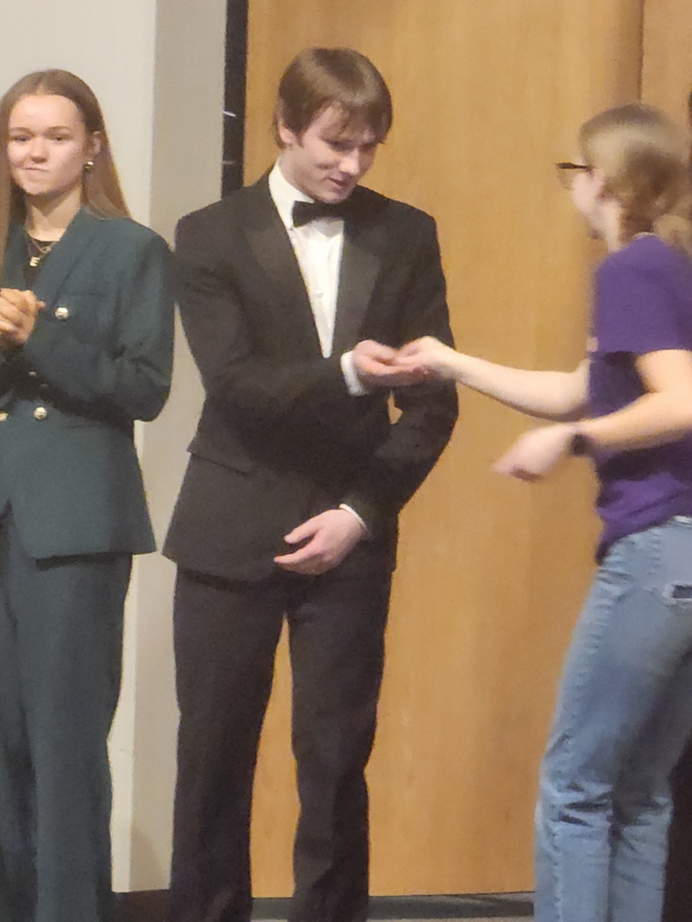 Ethan accepting 6th place medal