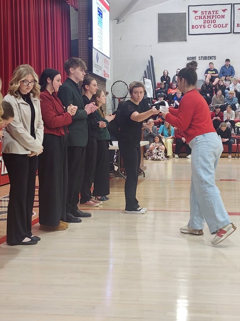 Jenna accepting medal