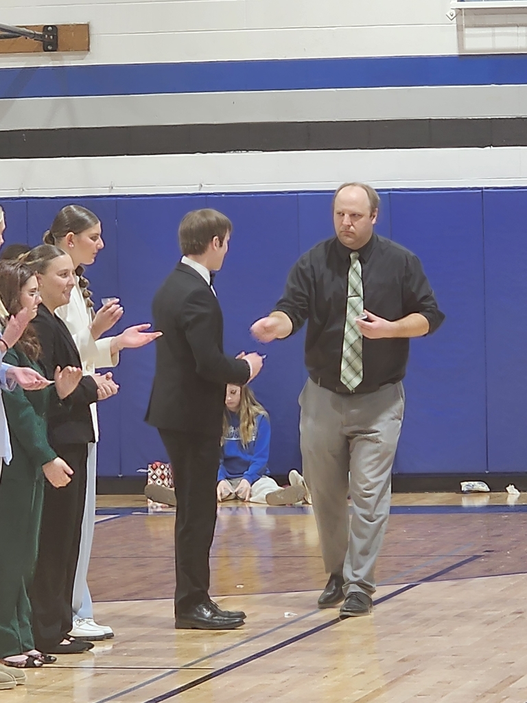 Ethan accepting Serious medal