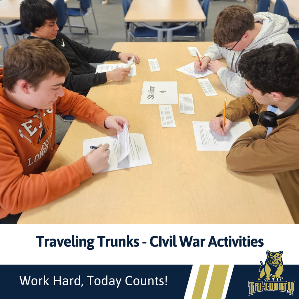 Students working on activities through exploration of civil war artificats provided by the traveling trunks program