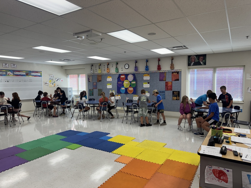 Students compose their own rhythms to perform with a song.
