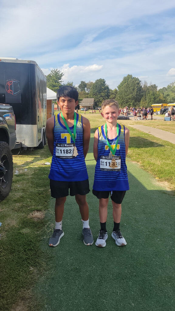 Cross Country runners with medals