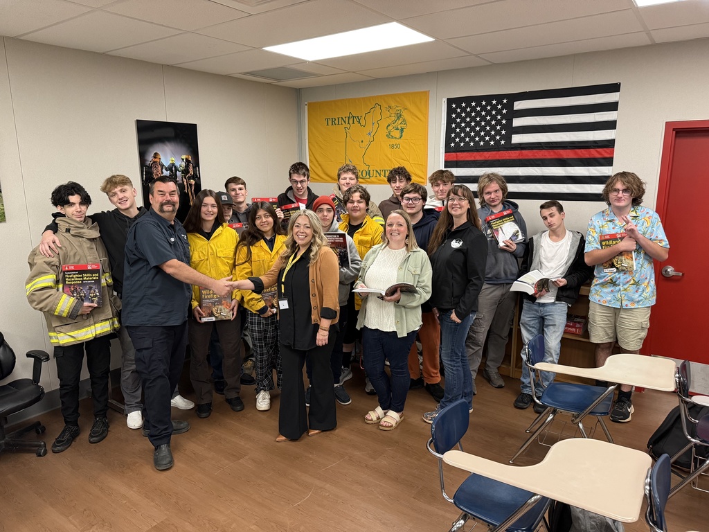 image of fire class receiving textbooks