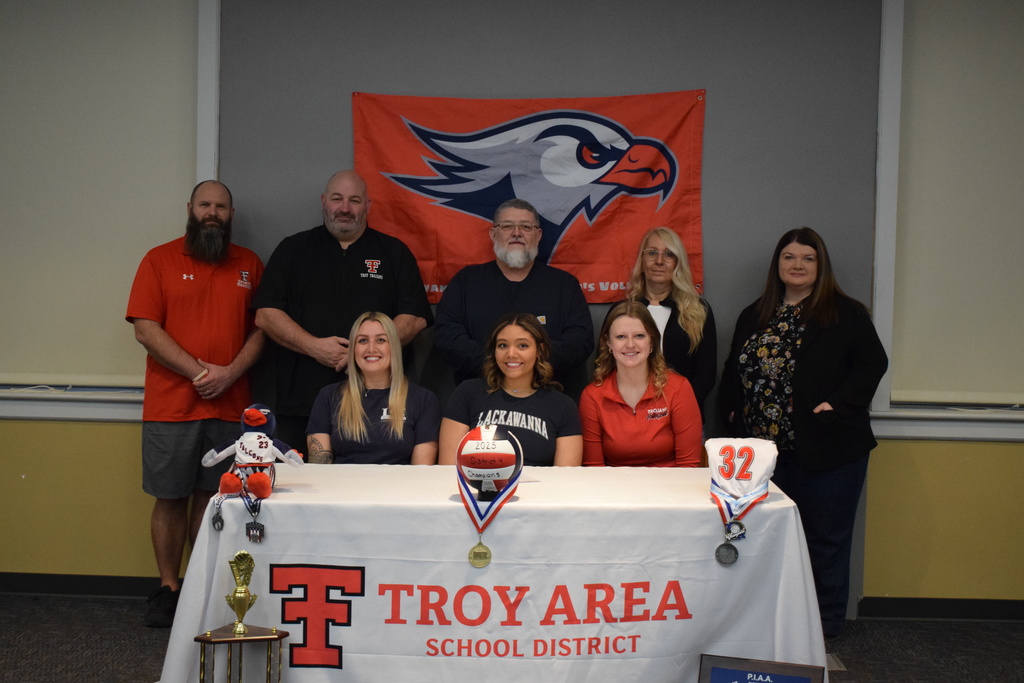 College Signing with family, coaches and administration
