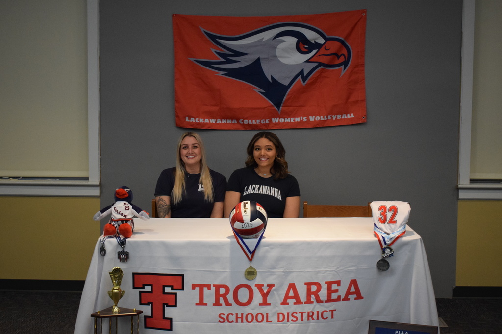 College signing with student and guardian