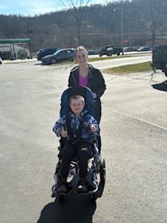 student and parent with stroller