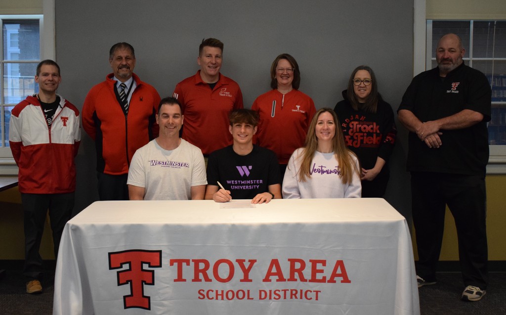 student, teaching staff, coaches, and parents for college signing