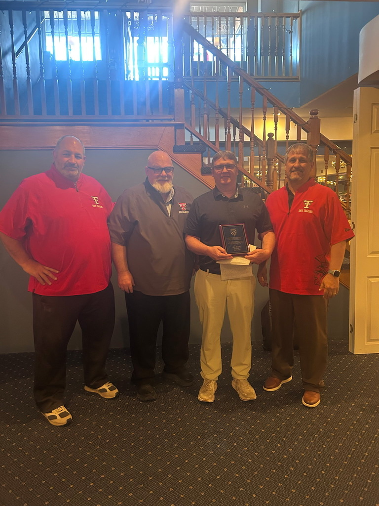 Athletic Director, Superintendent, Coach holding Coach of the Year Award,, and High School Principal