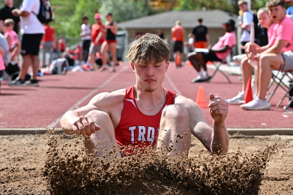 Student landing after his triple jump