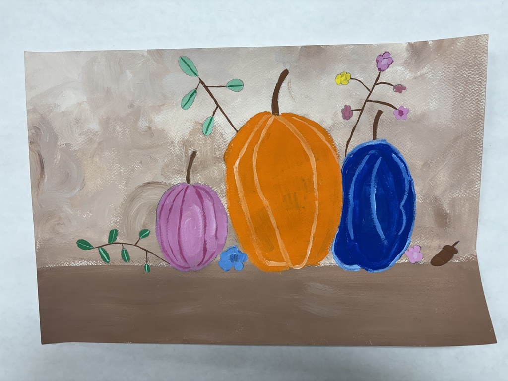 Picture of a purple, orange and blue pumpkins