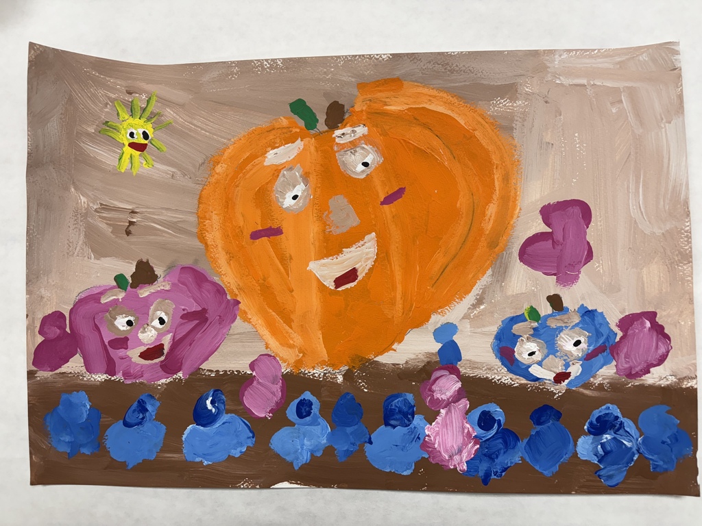 Painting of a purple, orange and blue pumpkin with smiley faces on them