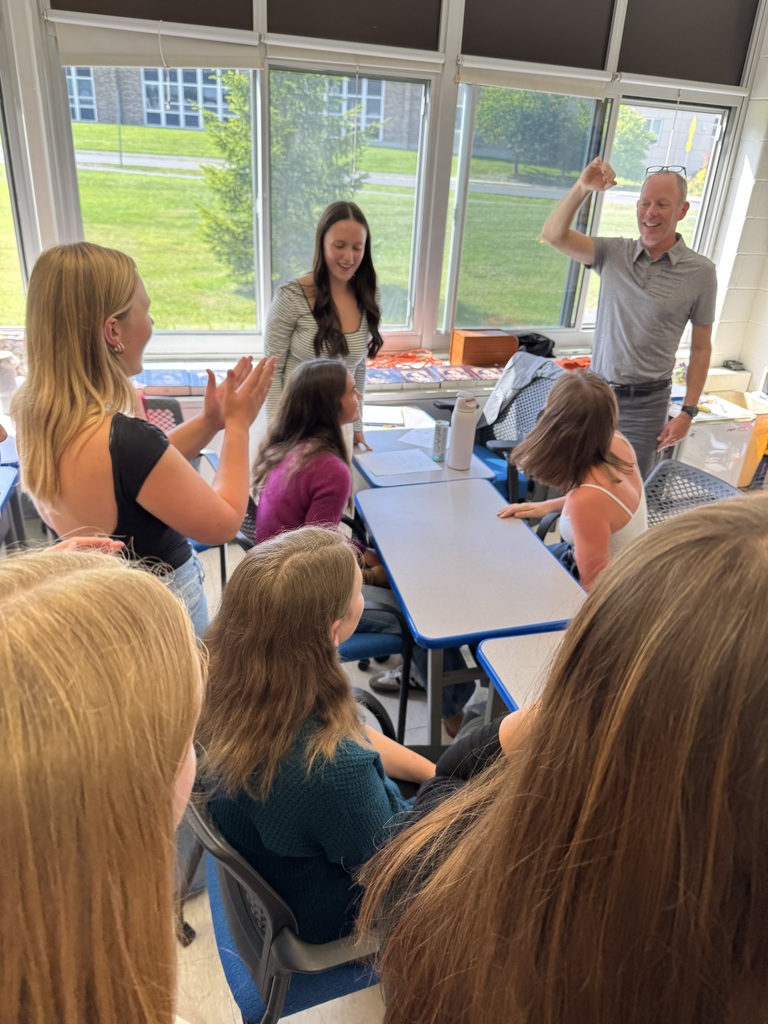11th grade English students engaging in discussions in their mock arm wrestling contest, as they work through themes in The Old Man and the Sea