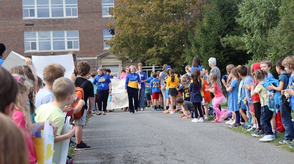 Sports team pep parade across the campuses