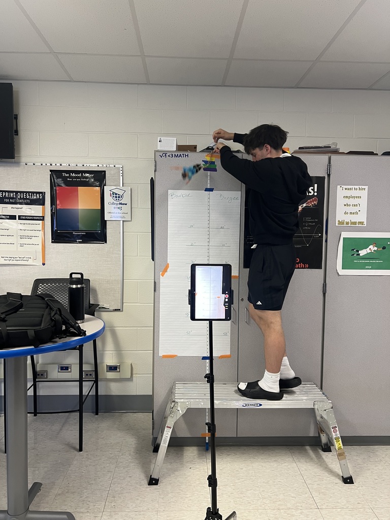 Students collecting data on Barbie bungie jump lab