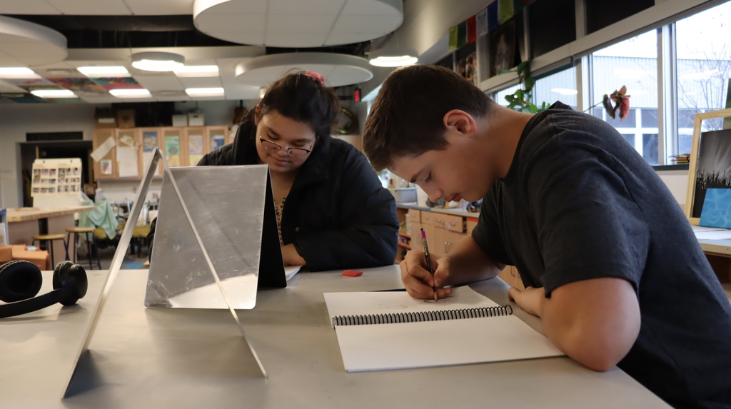 Students drawing self portraits