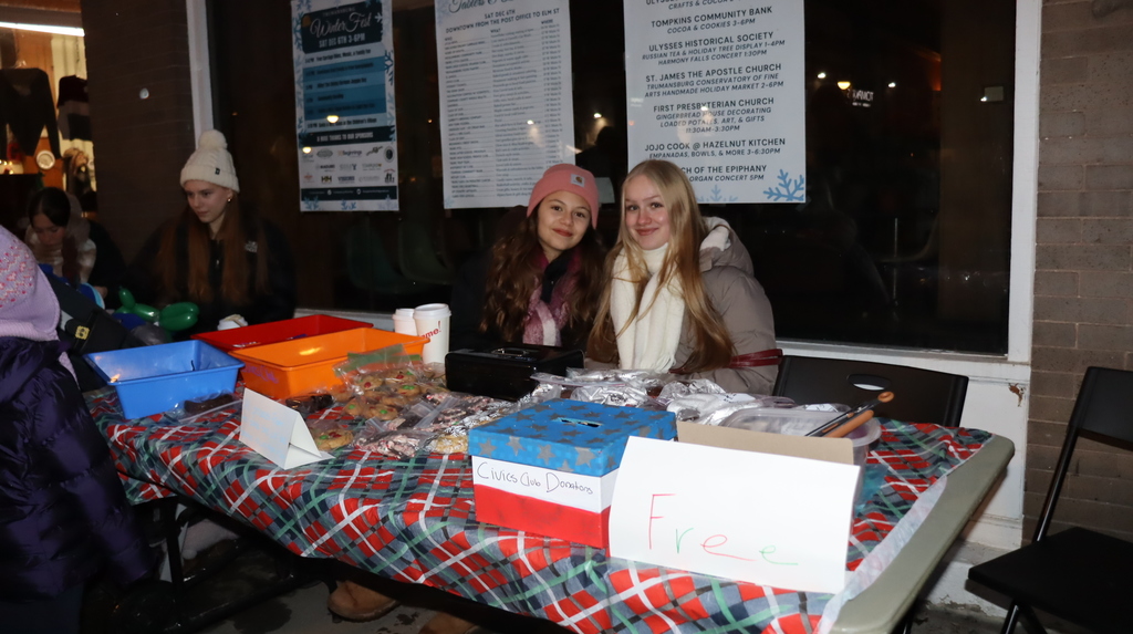 Students at a bakesale table
