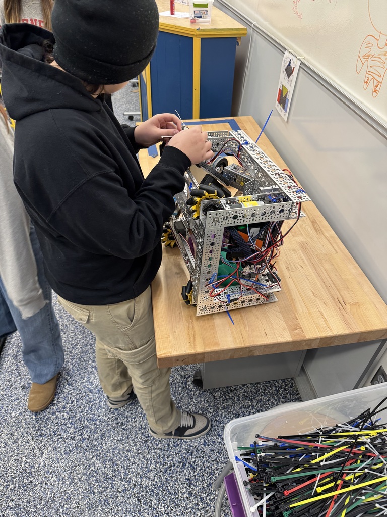 A student works a robotics project