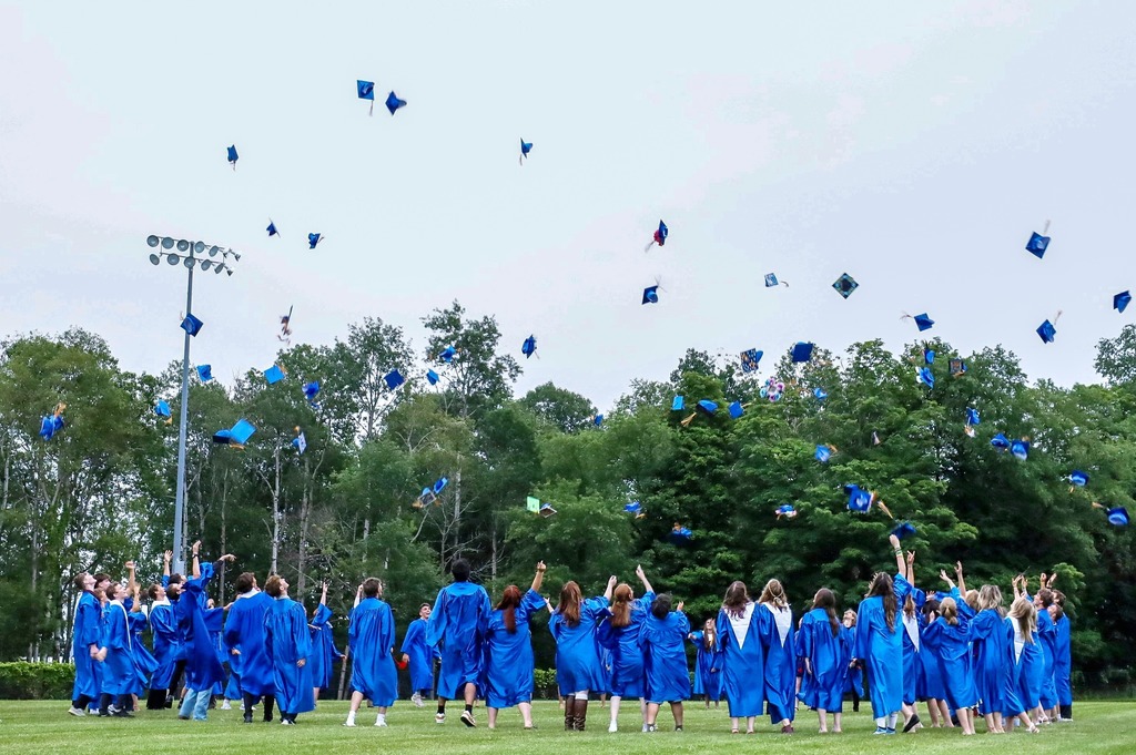 Students throw caps at graduation