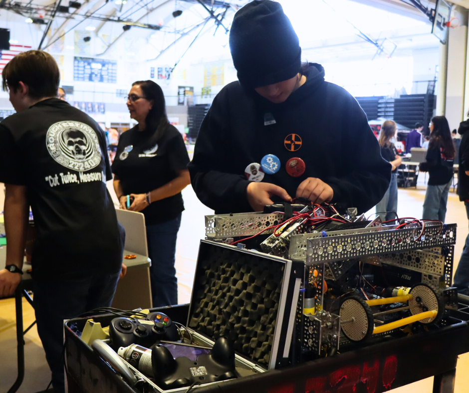 A student modifies the robot