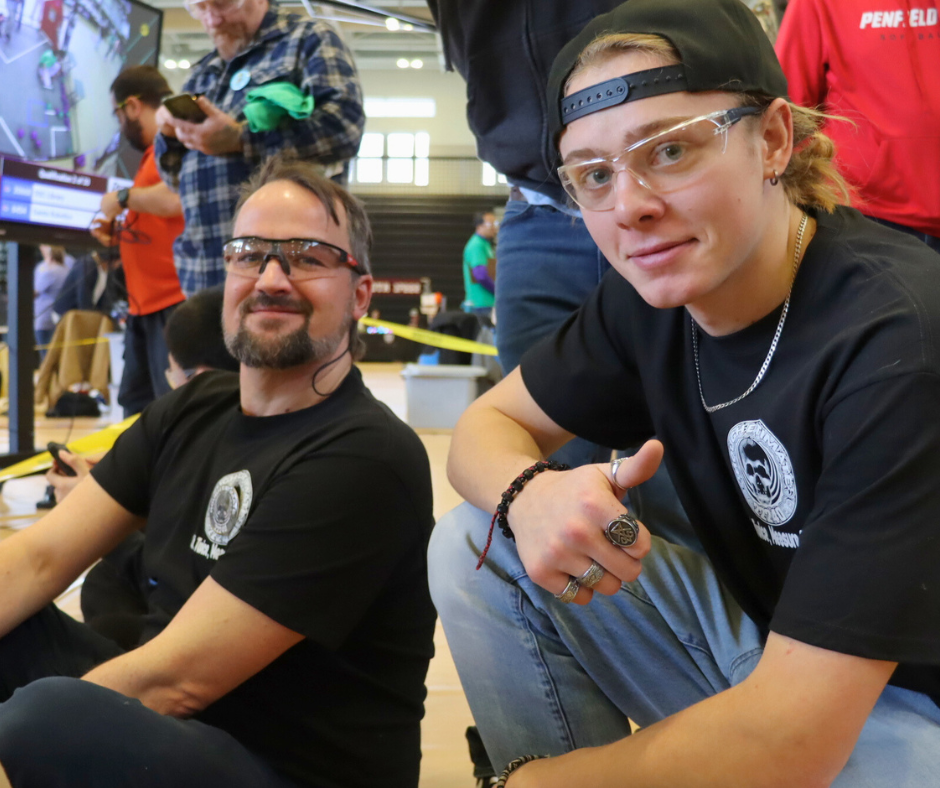 STEAM teacher and student smile for the camera