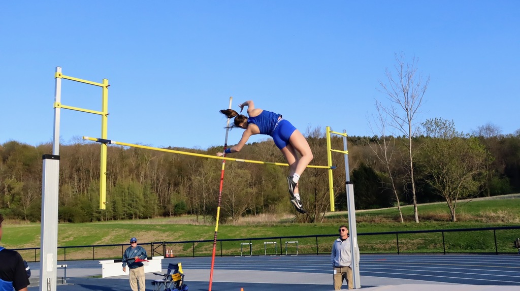A student successfully clears a pole vault