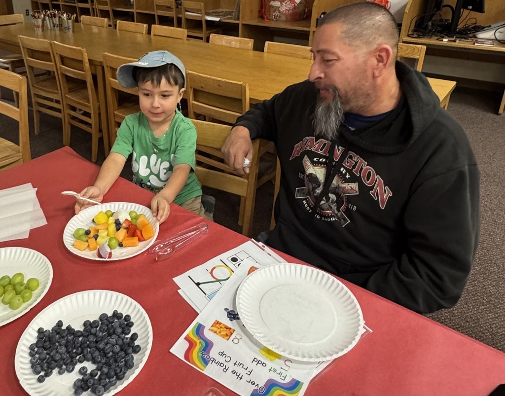 Parent snacking with student