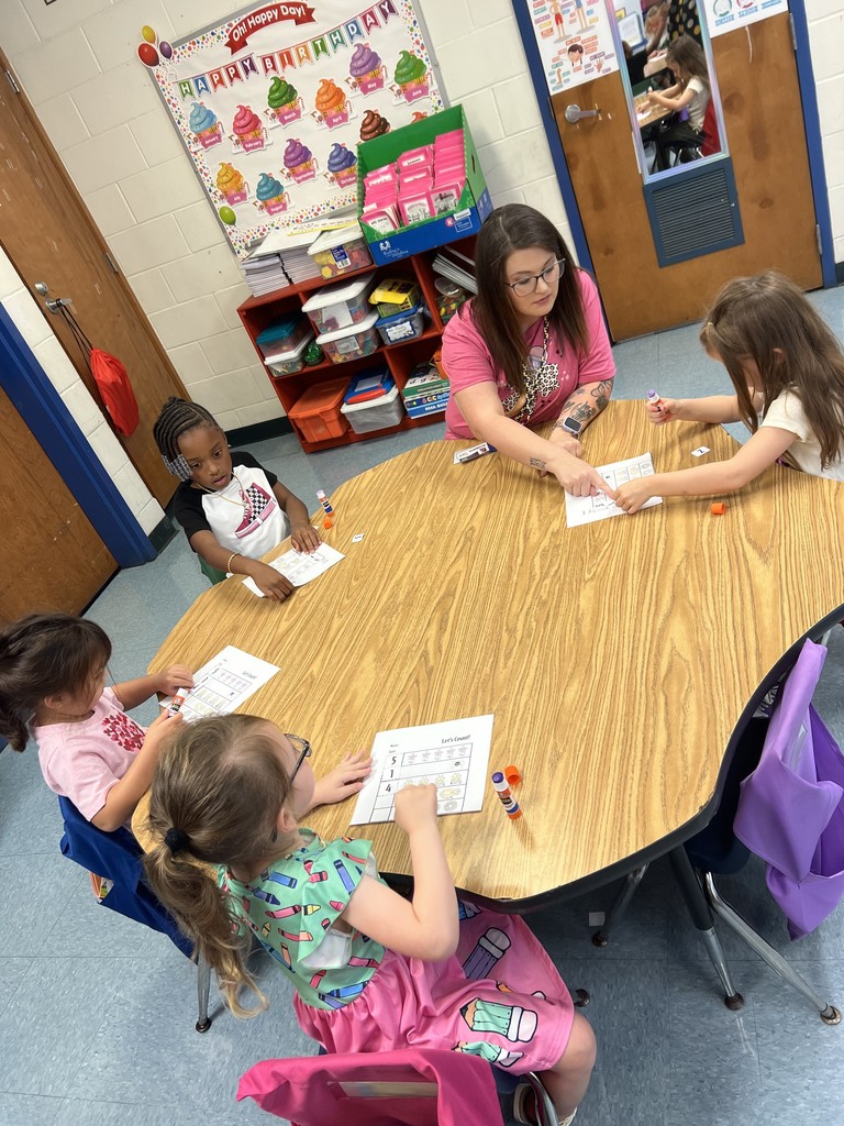 students with completed classwork, desks