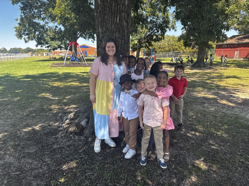 tree, teacher, students, crass, playground in background