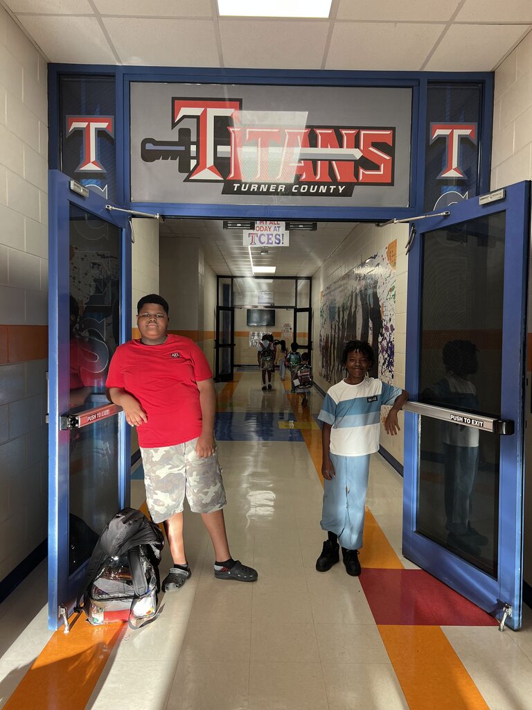 students, sword logo, doors