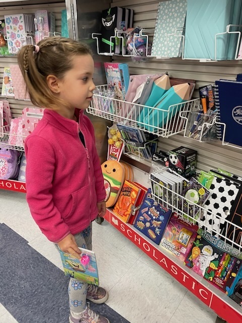 Student at journal shelf