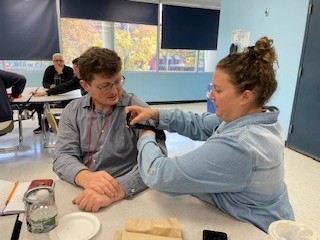 Faculty practice tourniquet application on each other