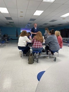 The instructor answers staff questions.