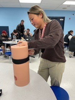 Principal Park practices tourniquet application